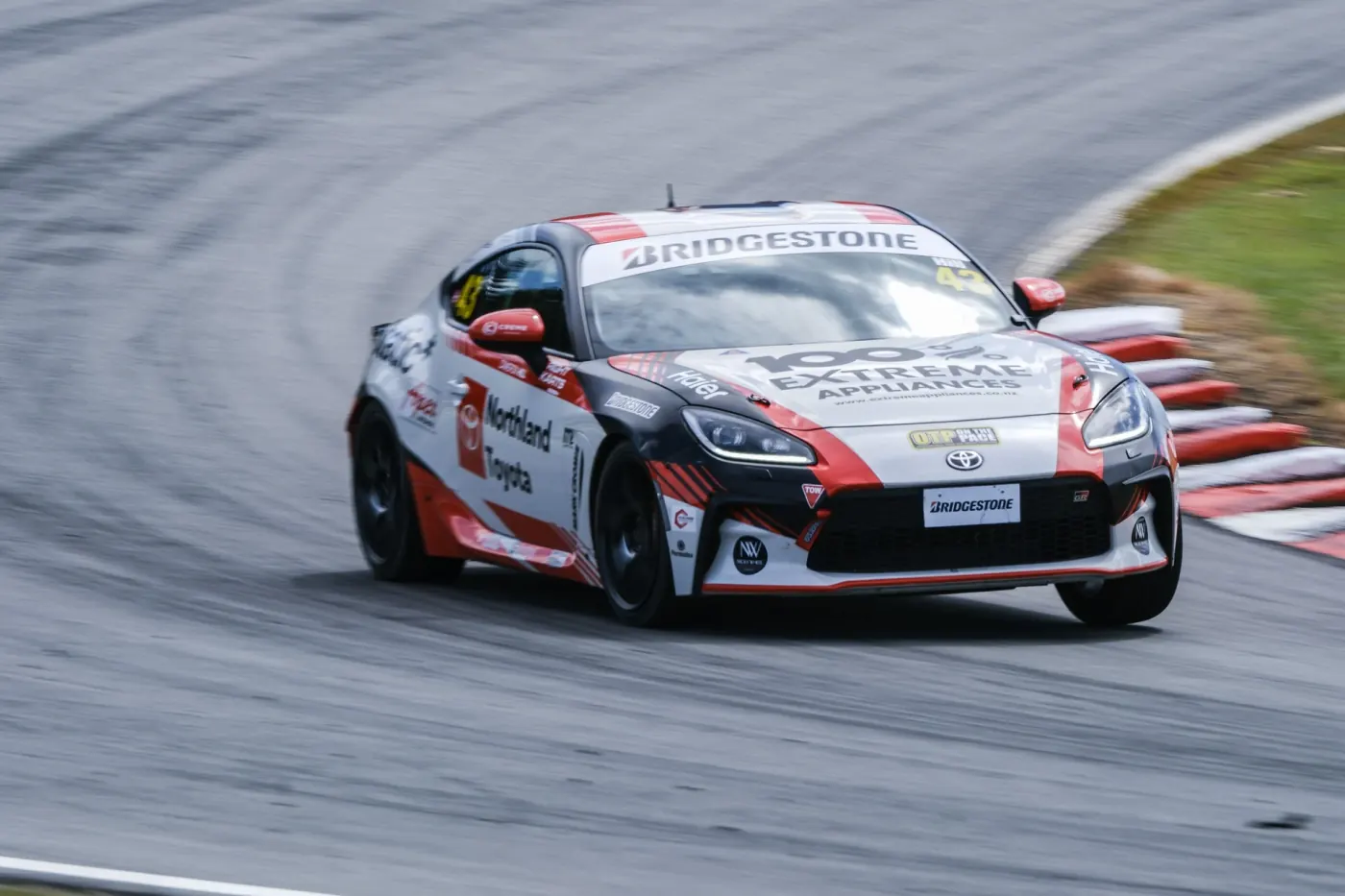 Cameron’s GR86, number 43, turning on track during a race.